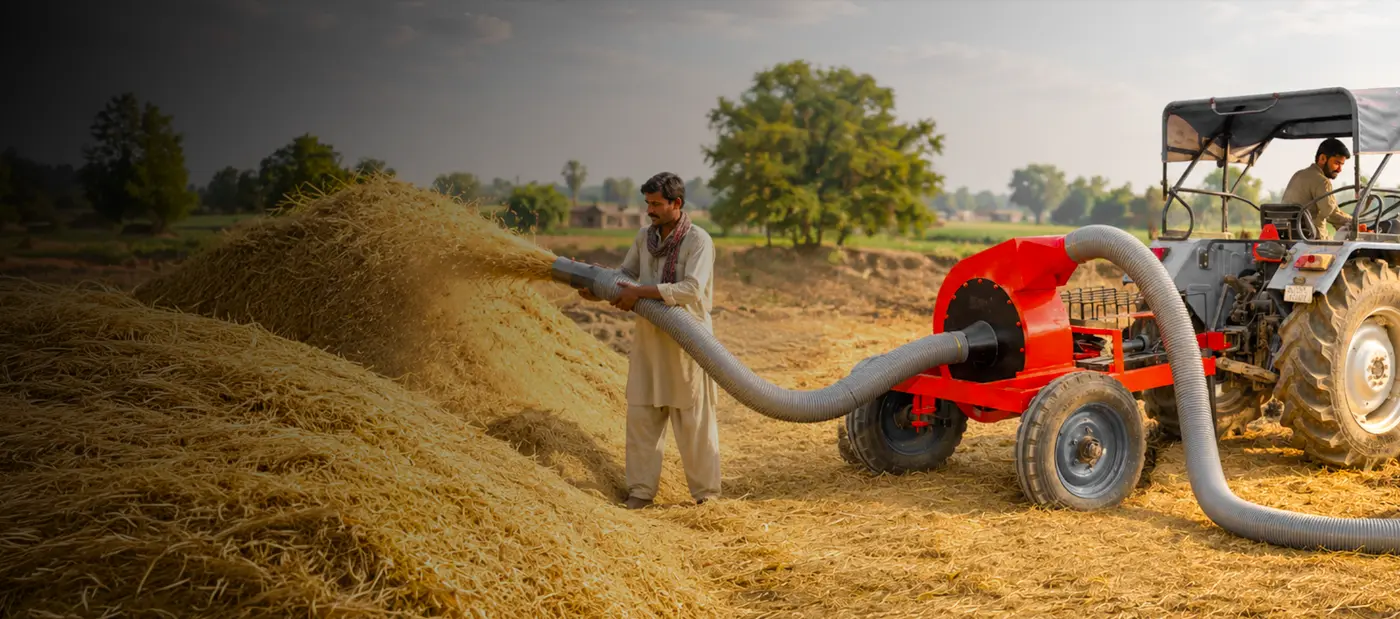Straw loader collecting bhusa in the field after harvest